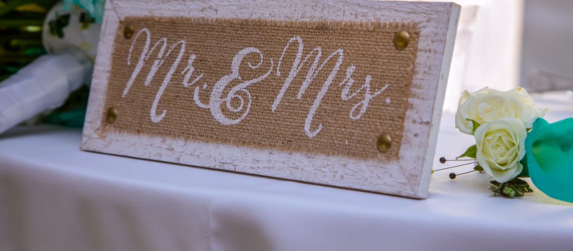 Mr and Mrs sign on wedding reception table